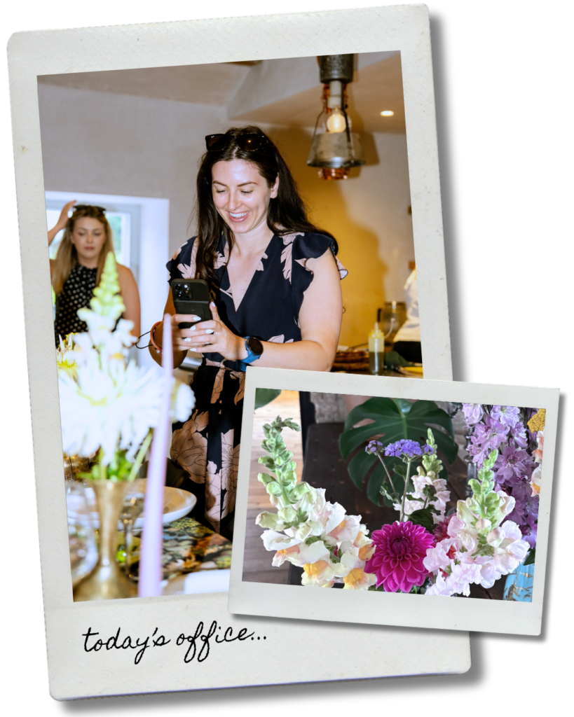 Sal filming on her phone at a Lagom Presents event, with a close-up of a colourful flower arrangement